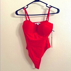 Small bright Red tank top and cupped breasts